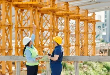 a person and person in hardhats